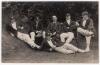 Nottinghamshire C.C.C. Professionals 1924. Sepia real photograph postcard of six Nottinghamshire professionals in informal pose, wearing cricket attire, caps and blazers. Players appear to include Barratt, Payton, Staples, Whysall, Walker etc. Photograph 