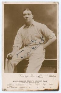 Henry &lsquo;Harry&rsquo; Howell. Warwickshire & England 1913-1928. Sepia real photograph postcard of Howell, three quarter length in a studio setting, wearing cricket attire and holding a ball. Nicely signed in ink to the photograph &lsquo;Yours truly, Harry Howell&rsquo;. Prin