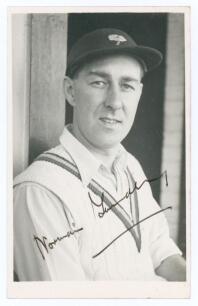 Norman Walter Dransfield Yardley. Cambridge University, Yorkshire & England 1935-1955. Mono real photograph plain back postcard of Yardley, head and shoulders wearing cricket attire and Yorkshire cap. Nicely signed &lsquo;Norman Yardley&rsquo; in black ink to the pho