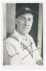 Norman Walter Dransfield Yardley. Cambridge University, Yorkshire & England 1935-1955. Mono real photograph plain back postcard of Yardley, head and shoulders wearing cricket attire and Yorkshire cap. Nicely signed &lsquo;Norman Yardley&rsquo; in black ink to the pho