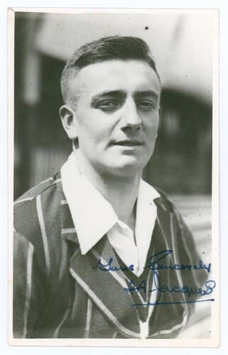 Thomas Alec Jacques. Yorkshire 1927-1936. Mono real photograph plain back postcard of Jacques, head and shoulders wearing cricket attire and blazer. Nicely signed in blue ink by Jacques. Official stamp for A. Wilkes & Son, West Bromwich to verso. Very goo