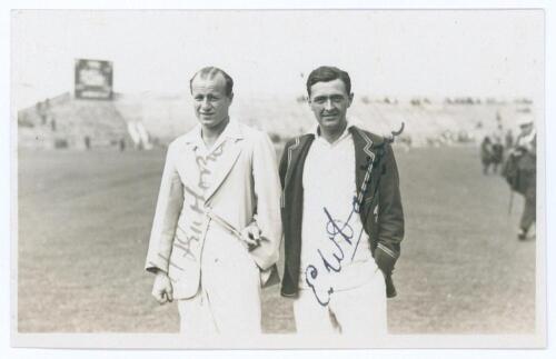 Tom Enthoven and Eddie Dawson. Scarborough 1929. Original mono real photograph plain back postcard of Enthoven and Dawson standing three quarter length on the outfield at Scarborough, wearing cricket attire and blazers. Signed in ink to the photograph by 