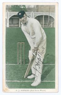 Albert John Young Hopkins. New South Wales & Australia. 1896-1914. Tinted colour printed postcard of Hopkins, full length, in batting pose wearing Australian cap at Lord&rsquo;s during the Australian tour of England in 1909. Nicely signed in black ink by Hopkin