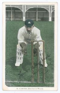 Hanson &lsquo;Sammy&rsquo; Carter, New South Wales & Australia, 1897-1925. Tinted colour printed postcard of Carter, full length, in wicket-keeping pose wearing Australian cap at Lord&rsquo;s during the Australian tour of England in 1909. Nicely signed in black ink by Cart