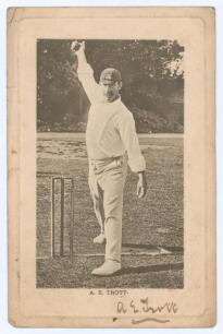 Albert Edwin Trott. Victoria, Middlesex, Australia & England 1892-1910. Sepia postcard of Trott in bowling pose wearing Middlesex cap. Nicely signed by Trott to lower border. Printed title &lsquo;A.E. Trott&rsquo;. Wrench Series 1754. Rare. Postmarked 1906. Wear to c