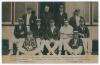 England v Australia 1905. Early original sepia real photograph postcard of the England team for the 4th Test at Old Trafford, 24th- 26th July 1905, the players seated and standing in rows wearing assorted blazers and caps. Players&rsquo; names printed to lower 