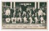 M.C.C. tour to India 1933/34. &lsquo;M.C.C. XI 1933&rsquo;. Original sepia real photograph postcard of the M.C.C. team and officials seated and standing in rows wearing tour blazers. Printed title and players&rsquo; names to borders. Players are Jardine (Captain), Human, B