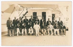 Bodyline. M.C.C. tour to Australia 1932/33. Rare original sepia real photograph plain back postcard of the M.C.C. touring party taken on board ship, the R.M.S. Orontes, the players seated and standing wearing cricket attire and tour blazers. Players inclu