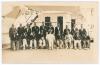 Bodyline. M.C.C. tour to Australia 1932/33. Rare original sepia real photograph plain back postcard of the M.C.C. touring party taken on board ship, the R.M.S. Orontes, the players seated and standing wearing cricket attire and tour blazers. Players inclu