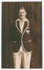 John Lambert &lsquo;Jack&rsquo; Kerr. Canterbury & New Zealand 1929-1940. Sepia real photograph plain back postcard of Kerr standing three quarter length wearing cricket attire and New Zealand blazer. Signed in ink with dedication, in part to the darker area of the p