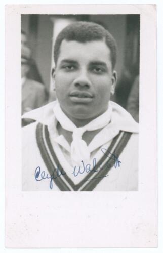Clyde Leopold Walcott. Barbados, British Guiana & West Indies 1941-1964. Mono real photograph plain back postcard of Walcott, head and shoulders wearing cricket attire. Nicely signed in blue ink to the photograph by Walcott. Annotation in ink to verso &lsquo;Au