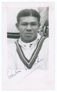 Everton de Courcy Weekes. Barbados & West Indies 1944-1964. Mono real photograph plain back postcard of Weekes, head and shoulders wearing cricket attire. Nicely signed in blue ink to the photograph by Weekes. Annotation in ink to verso &lsquo;Autographed 31st 