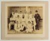 South v North 1893. Large early original sepia photograph of the South team, standing and seated in rows, wearing caps and cricket attire, in front of the pavilion at Hastings for the Festival match played 11th- 13th September 1893. Players featured are W