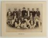 Somerset C.C.C. c.1893. Large early original mono photograph of the Somerset team seated and standing in rows wearing cricket attire and assorted caps and blazers. Players are Hewett (Captain), Newton, Hedley, Woods, Challen, Nichols, Dunlop, Hill, G. Woo