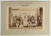 &lsquo;London County Cricket Club v Cambridge University at the Crystal Palace June 1902&rsquo;. Large original sepia photograph of the two teams seated and standing in rows wearing cricket attire and assorted blazers in front of the clubhouse at Crystal Palace for t