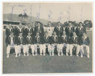 Australia tour to West Indies 1954/55. Official mono photograph of the Australian touring party seated and standing in rows wearing tour blazers. The photograph is fully signed in ink by all seventeen featured members of the touring party and one other, e