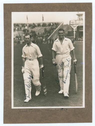 M.C.C. Australian Touring Team v C.I. Thornton&rsquo;s XI, Scarborough 1928. Original mono photograph of Ernest Tyldesley (Lancashire) and Maurice Tate (Sussex) walking out to bat for M.C.C. at Scarborough with crowds in the stands in the background, for the ma