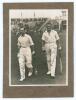 M.C.C. Australian Touring Team v C.I. Thornton&rsquo;s XI, Scarborough 1928. Original mono photograph of Ernest Tyldesley (Lancashire) and Maurice Tate (Sussex) walking out to bat for M.C.C. at Scarborough with crowds in the stands in the background, for the ma