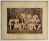 &lsquo;Notts County Team, 1891. Taken at The Oval, Kennington, August 3rd&rsquo;. Large original sepia photograph of the Nottinghamshire team seated and standing in rows wearing cricket attire, assorted caps and blazers. Printed title and players&rsquo; names to lower bord