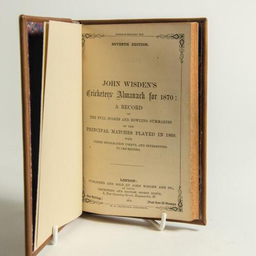 Wisden Cricketers&rsquo; Almanack 1870. 7th edition. Bound in brown boards, lacking original paper wrappers, with title and date in gilt to spine, red speckled page edges, marbled end papers. Pages checked, complete. Pages trimmed by the binder. Very minor foxi