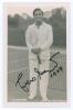 Francisco Olegario Segura Cano &lsquo;Pancho Segura&rsquo;. 1940s/1950s. Sepia real photograph plain back postcard of Segura standing full length in tennis attire at the net. Very nicely signed in black ink to the photograph &lsquo;Pancho Segura&rsquo; and dated 1947[?]. Printed - 3