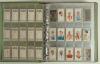 Football trade cards 1920s onwards. Green binder comprising a large selection of over nine hundred football cigarette and trade cards with some complete sets. Some are earlier issues, the majority modern issues and reprints. Earlier series include Chums &lsquo; - 10