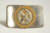 Cricket belt buckle. Two piece detachable silver metal belt buckle decorated to centre with gilt metal circular decoration with additional silver plate laurel wreath with crossed bat and stumps with cricket ball to centre, beaded border. Approximately 3.2