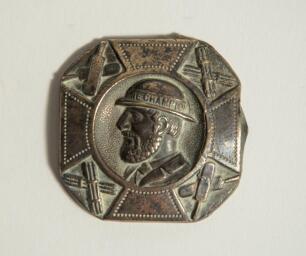 &lsquo;The Champion&rsquo;. Early brass cricket belt buckle of square form with rounded corner with head and shoulders image of a bearded cricketer wearing a bowler style hat with the legend &lsquo;The Champion&rsquo; to the hat band. The image of the cricketer at the centre of 