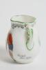 &lsquo;Good for Fifty&rsquo;. Royal Doulton Black Boy miniature two handled vase, with printed image of a boy in red shirt and a floppy hat in batting pose in front of the wicket to one side and to the other, a crest with &lsquo;The All Black Team&rsquo;. Green floral decoration - 2