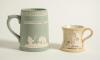 Cricket mugs/tankards. Small Staffordshire 3&rdquo; waisted cricket mug with strap handle and beaded rim, with cream background and three raised figures in white of a batsman, bowler and wicket keeper, believed to be Lillywhite, Pilch and Box. c1870. Silver lus