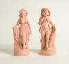 Cricket and Tennis figures. Pair of cricketing and tennis figures in terracotta glaze with originally gold lustre. The boy figure holding a cricket bat to side with ball in hand and the girl a tennis racket and ball. Both wearing hats and stood on natural