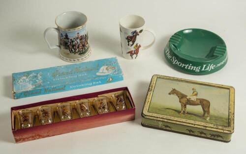 Horse racing. Small box comprising a selection of horse racing and other sporting ephemera. Contents include a Huntley and Palmer biscuit tin with colour image to lid of &lsquo;Early Mist&rsquo;, winner of the 1953 Grand National. &lsquo;Grand National Drinking Set&rsquo; of six