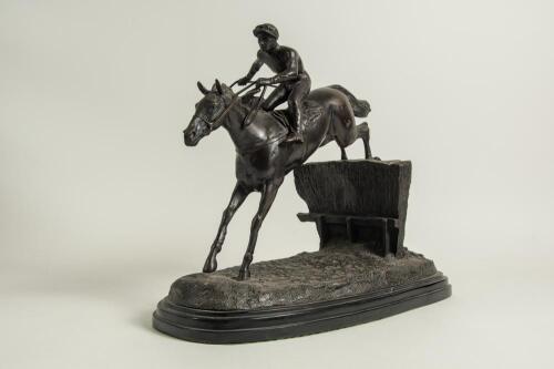 Horse racing. Paul Louis Emile Loiseau-Rousseau, Paris 1861-1927. A fine late 19th century French bronze sculpture of a steeplechase race horse and jockey beautifully captured in full flight while taking a jump over a naturalistically cast hedge on simila