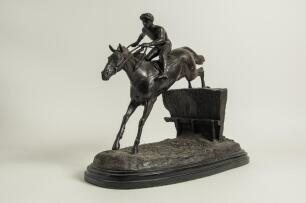 Horse racing. Paul Louis Emile Loiseau-Rousseau, Paris 1861-1927. A fine late 19th century French bronze sculpture of a steeplechase race horse and jockey beautifully captured in full flight while taking a jump over a naturalistically cast hedge on simila