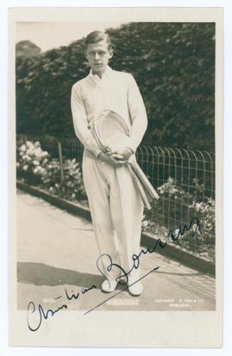 Christian Boussus. 1930s. Sepia real photograph postcard of Boussus standing full length in tennis attire. Very nicely signed in black ink to the photograph &lsquo;Christian Boussus&rsquo;. Printed title to lower edge. Published by E. Trim of Wimbledon, series no. W1