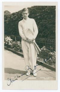 Christian Boussus. 1930s. Sepia real photograph postcard of Boussus standing full length in tennis attire. Very nicely signed in black ink to the photograph &lsquo;Christian Boussus&rsquo;. Printed title to lower edge. Published by E. Trim of Wimbledon, series no. W1
