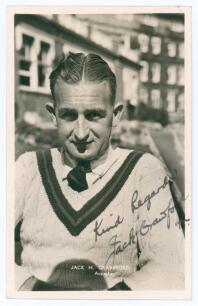 John Herbert &lsquo;Jack&rsquo; Crawford. Mono real photograph postcard of Crawford, head and shoulders wearing tennis sweater and tie. Very nicely signed in ink to the photograph &lsquo;Kind regards, Jack Crawford 1936[?]&rsquo;. Printed title &lsquo;Jack H. Crawford. Australia&rsquo;. Pub