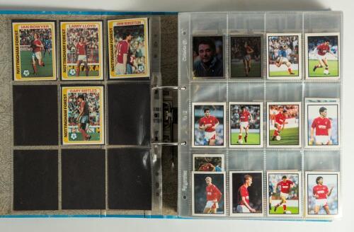 Nottingham Forest Football Club 1970/90&rsquo;s. A large light blue album containing a large collection of trade and collectors cards featuring Forest players from the period. Cards from Topps Chewing gum 1977, 1978, 1979, 1980, 1981, Daily Mirror &lsquo;Soccer 88&rsquo; s