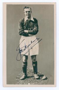 Joe Hulme. Mono real photograph postcard of Hulme, full length in Arsenal strip c.1928/29. Very nicely signed to the photograph &lsquo;Joe Hulme&rsquo;, with printed title to lower edge. Publisher unknown. Postally unused. Very good condition.