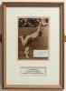 Leonard Litton Wilkinson. Lancashire & England. Mounted, framed and glazed photographic image of Wilkinson bowling with ink signature on paper piece attached. 7.5&rdquo;x11&rdquo;. Sold with a modern postcard of the pavilion at Trent Bridge signed by Wilkinson to the