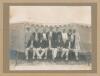 &lsquo;Australia Cricket Team. New Zealand Tour, 1913-1914&rsquo;. Excellent and rare large original mono photograph of the Australian touring party, seated and standing in rows, wearing cricket attire and blazers in front of a large marquee. Players are Arthur Simms