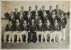 Australian tour of England 1964. Very large mono photograph of the twenty one members of the full Australian touring party, standing and seated in rows, the players wearing tour blazers and cricket attire. Signed to the photograph by the majority of the p