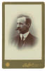 William Peter Howell. New South Wales & Australia 1894-1905. Excellent sepia cabinet card photograph of Howell, head and shoulders, wearing three piece suit and tie c1899. The cabinet card photograph by T. Bolland of London. The card measures 4.25&rdquo;x6.5&rdquo;. 