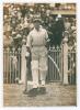 Donald George Bradman. New South Wales, South Australia & Australia 1927-1949. Wonderfully evocative original sepia press photograph of Don Bradman having just passed thorough the gate onto the pitch at Melbourne to bat against England in the second Test 