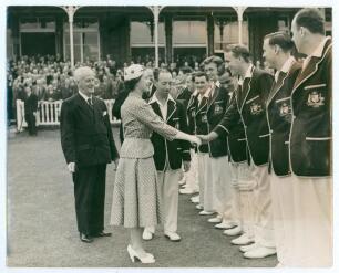 England v Australia 1953 &lsquo;Coronation Tour&rsquo;. Original mono press photograph of the Australian team, wearing tour blazers, being presented to HM The Queen at Lord&rsquo;s for the tour match v Middlesex 18th- 21st July 1953. Players include Hassett (Captain), Hole