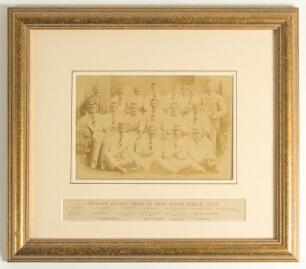 &lsquo;The English Cricket Team on Tour, South Africa 1891/92&rsquo;. Original sepia photograph of the team with Umpire J. Leaney, standing and seated in rows, wearing cricket attire and tour caps. Players featured include W.W. Read (Cpt), J.T.Hearne, Pougher, Brann,