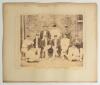 &lsquo;Surrey County Team, 1891. Taken at The Oval, Kennington, August 3rd&rsquo;. Large original sepia photograph of the Surrey team seated and standing in rows wearing cricket attire, Surrey caps and assorted blazers. Printed title and players&rsquo; names to lower borde