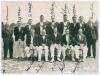 Surrey County Cricket Club circa1950. Good mono press photograph of the Surrey team, standing and seated in rows, wearing club blazers. The photograph, by Barratt&rsquo;s Photo Press Ltd, nicely signed in ink by twelve of the players featured including Barton (