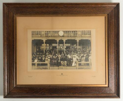 W.G. Grace at the cricket early 1900s. Large early original sepia photograph of a large group of cricketers, friends, ladies, gentlemen and dignitaries seated and standing in rows in and in front of the Crystal Palace cricket pavilion in the early 1900s. 