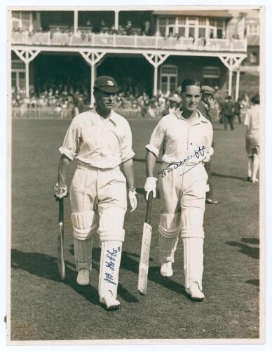 Jack Hobbs and Herbert Sutcliffe. Original mono photograph of Hobbs and Sutcliffe walking out to bat at Scarborough. Very nicely signed in ink to the photograph by both players. Date and photographer unknown, probably 1920s. 6.5&rdquo;x8.5&rdquo;. Pin holes to extrem